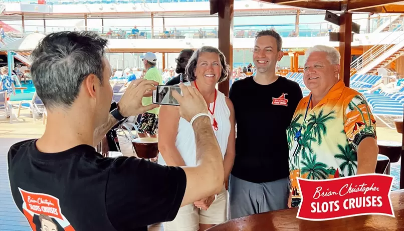 Brian Christopher takes pictures with fans while onboard a Carnival Cruise Line ship