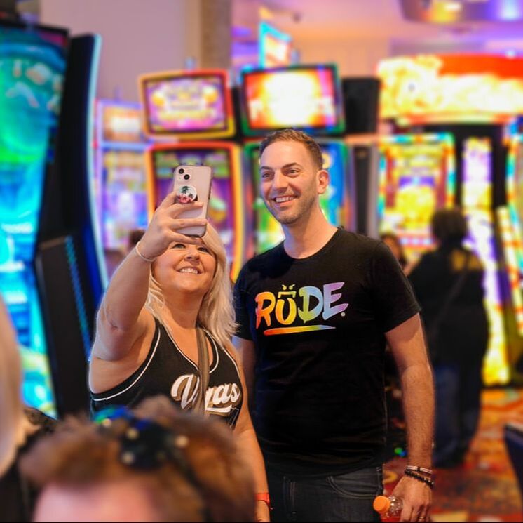 Brian takes a selfie with a fan in the new Brian Christopher Slots at Plaza area